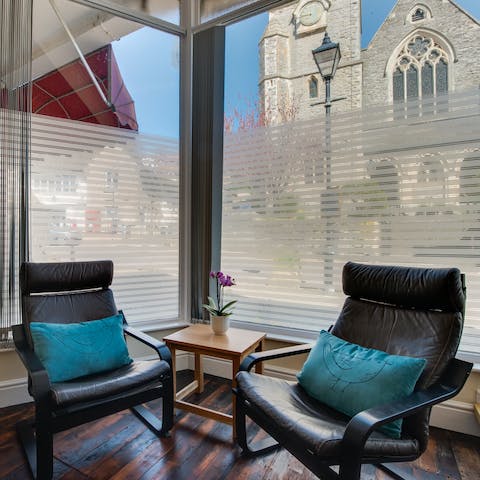 Bask in the lounge with the glorious sight of the stone church
