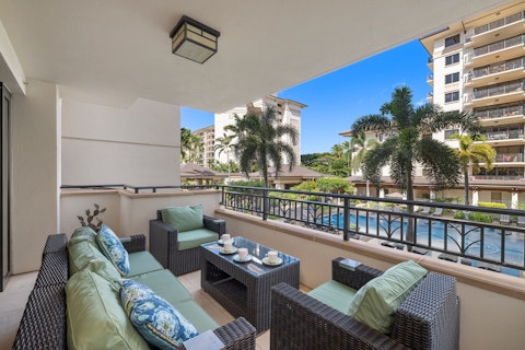 Sit out on the lanai overlooking the pool and palms