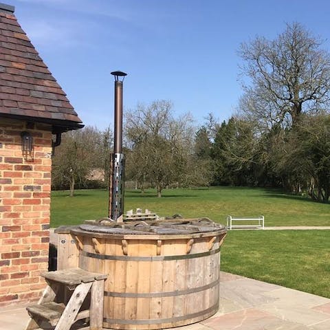 Soak in the Swiss-style wood fired hot tub overlooking the Worcestershire countryside