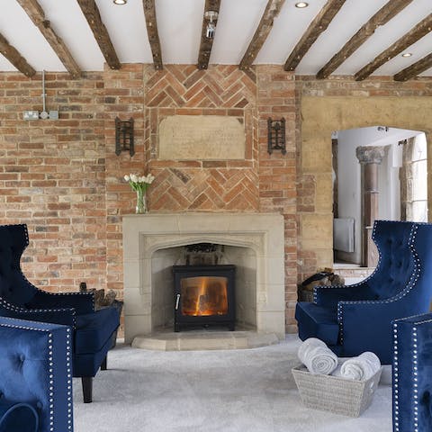Gather around the log burner fire on cooler nights