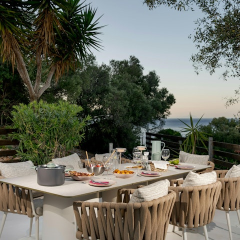 Set the table ready for a sunset dinner of Greek delicacies