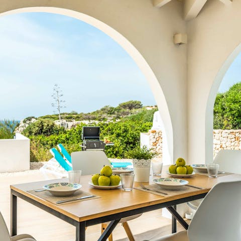 Enjoy an alfresco meal at the outdoor dining table