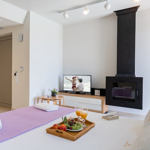 Light up the fireplace for some added cosiness once night falls