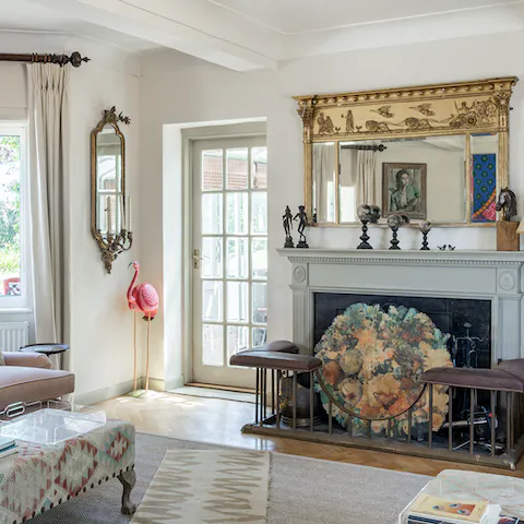 Snuggle up in front of the fire in the elegant living room