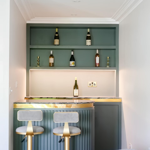 Sip a gin martini around the small bar