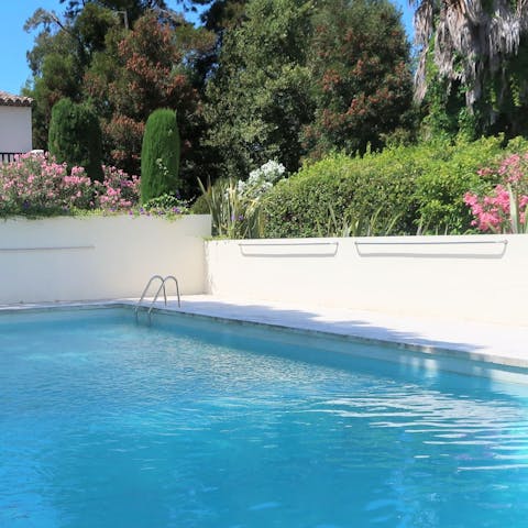 Swim a few lengths in the communal pool, surrounded by lush greenery