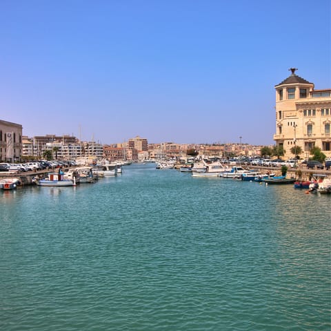 Arrange a boat trip around the island to explore Ortigia from the sea