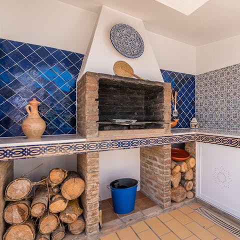 Cook up a feast on the rustic outdoor barbecue grill
