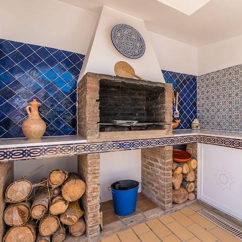 Cook up a feast on the rustic outdoor barbecue grill