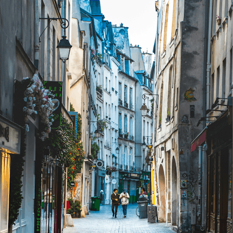 Explore the vibrant bars of Le Marais, fifteen-minute walk away