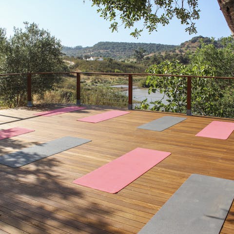 Start your morning with a yoga session overlooking the dam