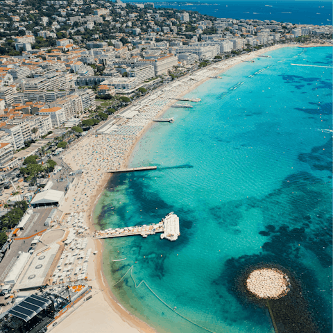 Stroll along Cannes' famous sandy beach, just a five-minute walk away