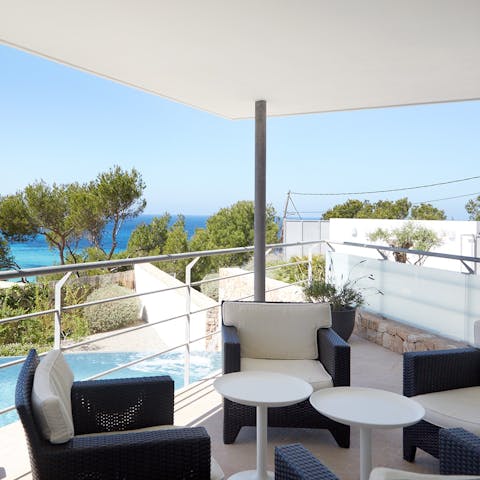 Sip on your favourite cocktail overlooking the pool