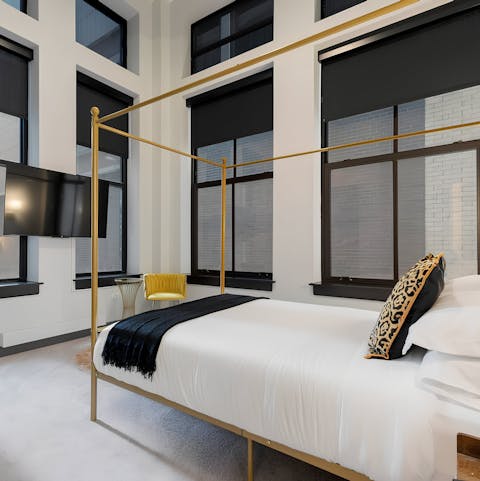 Rise and shine to panoramic city vistas from your bed