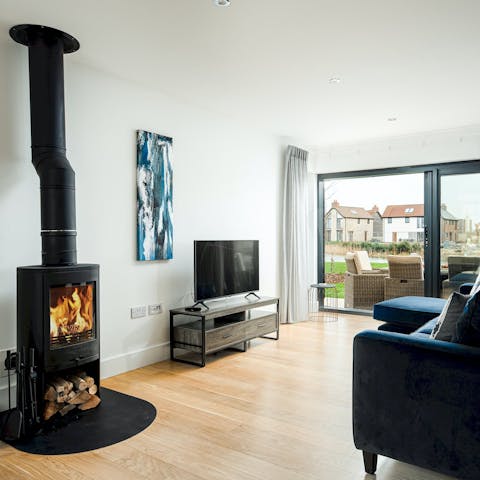 Snuggle up in front of the wood burner after a day outdoors