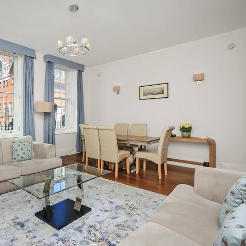 Relax in the bright living space with large sash windows and oak details