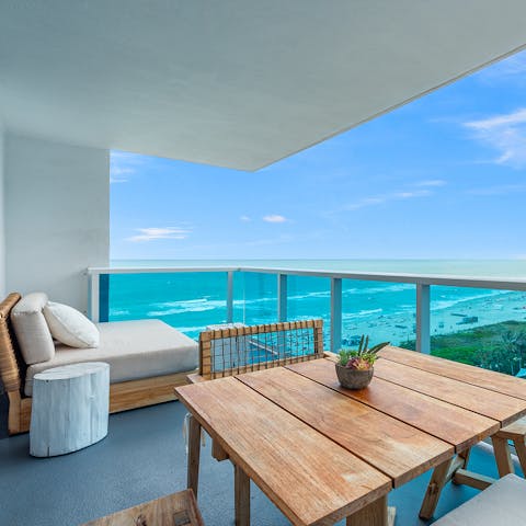 Dine outside on the private balcony, overlooking the ocean