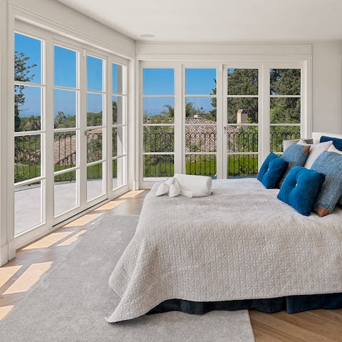 Wake up each morning in the main bedroom to sunshine and stunning views