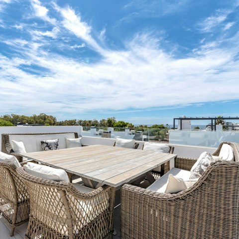 Gather on the roof terrace for sunset cocktails