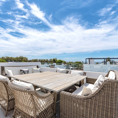 Gather on the roof terrace for sunset cocktails