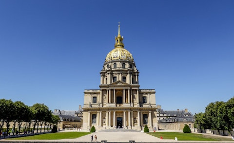 Visit Les Invalides, housing Napoleon's tomb beneath a gleaming golden dome