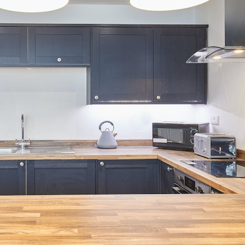 Cook meals at home in the large kitchen