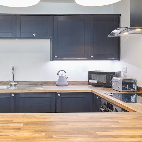 Cook meals at home in the large kitchen