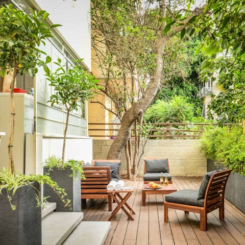 Sip celebratory sundowners in the leafy private patio garden