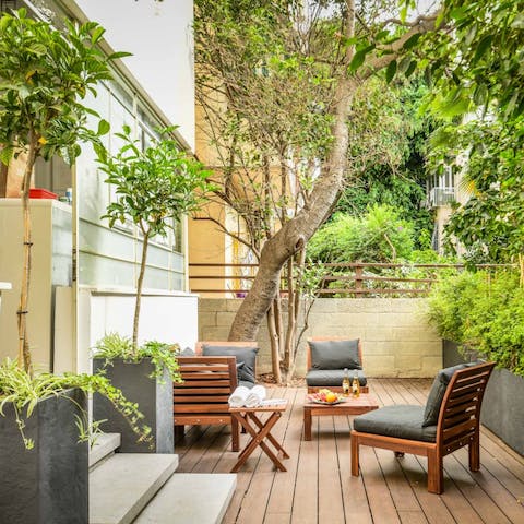 Sip celebratory sundowners in the leafy private patio garden