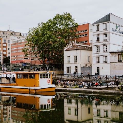 Explore the waterside cafés along Canal Saint-Martin, a nine-minute walk away