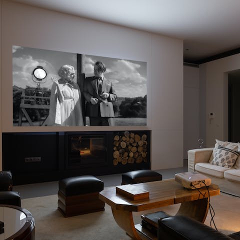 Spend cosy nights in watching movies on the projector