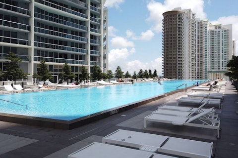 Swim laps in the communal pool above the Miami skyline on a clear day