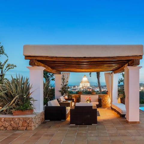 Enjoy a bottle of Veuve under the chandelier of your pergola