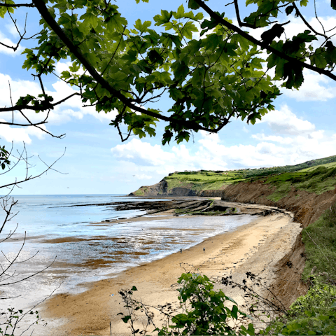 Stroll along the sands of Whitby Beach, it's a ten-minute drive away