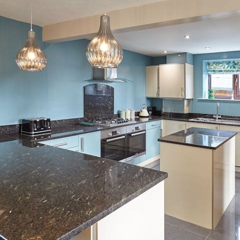 Whip up family favourites in the sleek and sociable kitchen