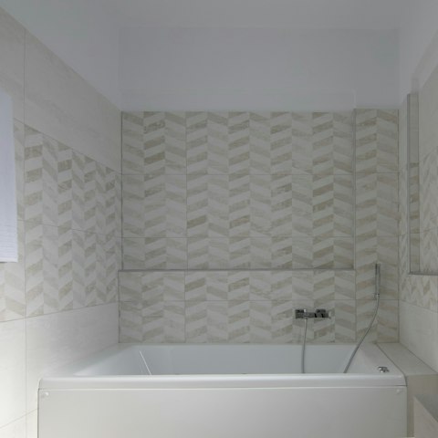 Soak in the bathtub after soaking up the local beaches
