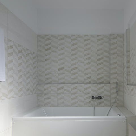 Soak in the bathtub after soaking up the local beaches