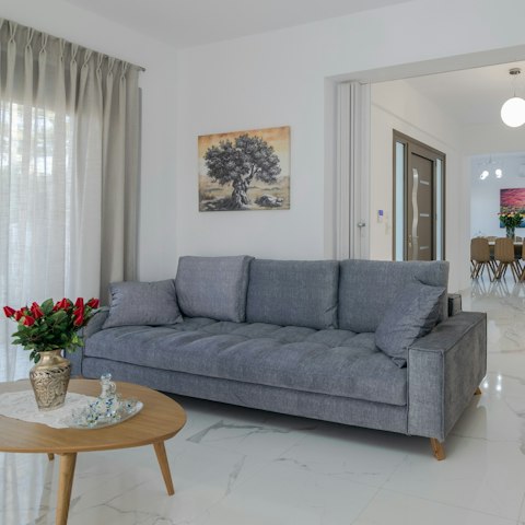 Stretch out in the comfy living area after days discovering Crete