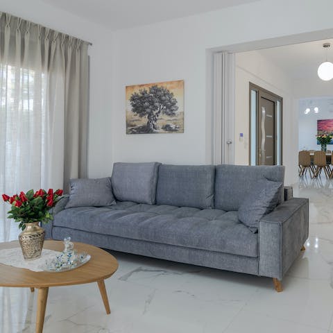 Stretch out in the comfy living area after days discovering Crete