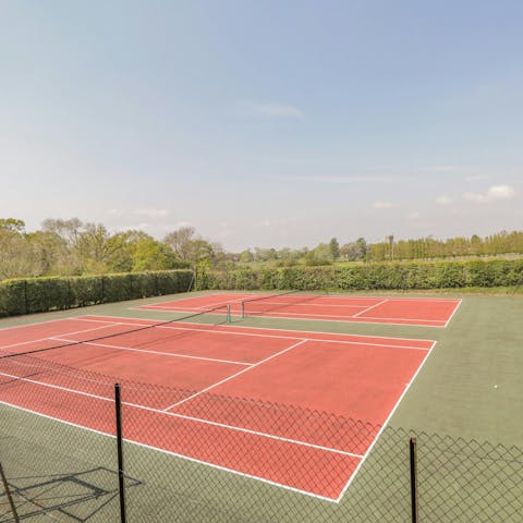 Practice your serve on the shared tennis courts