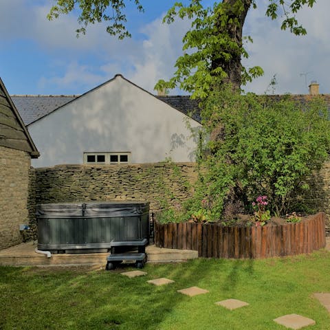 Relax and unwind in this home's hot tub