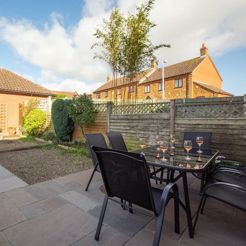 Enjoy drinks, food and sunsets in your private back garden