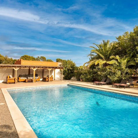 Sprawl out by the swimming pool on a sunny afternoon