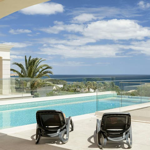Soak up the sea views as you lounge by the private pool