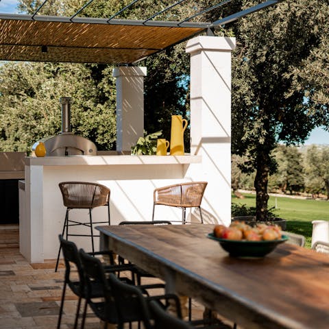 Light the barbecue and serve your favourite drinks at the bar