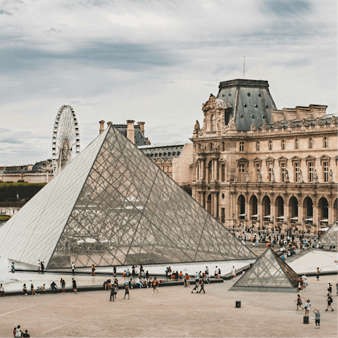 Marvel at masterpieces in the Louvre, twenty-minute walk away