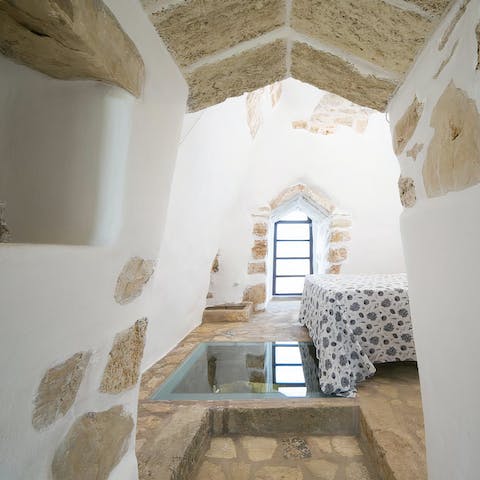 Stand over the glass insert to see the rustic stonework below