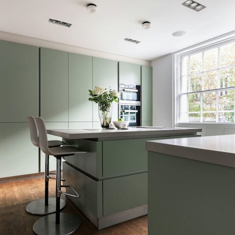 Cook up a storm in the sage green kitchen