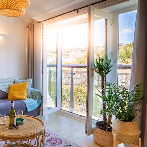 Open up the patio doors to enjoy some fresh air and beautiful views