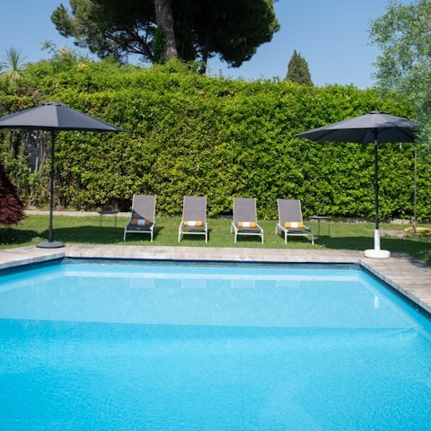 Dive into the pool to cool off after a morning sightseeing